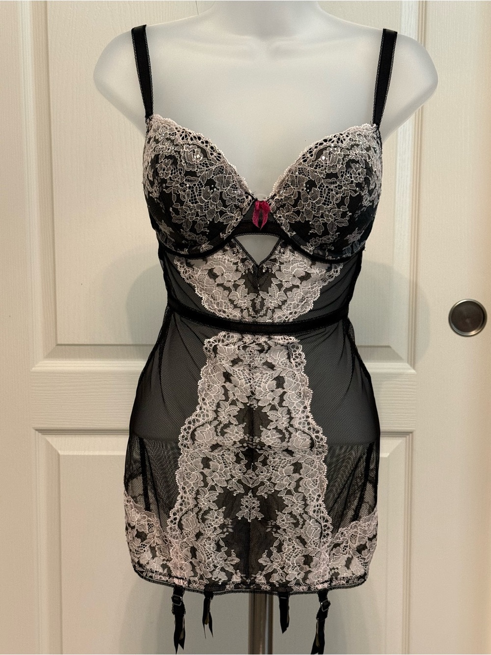 Brand new Victoria's Secret teddy features black sheer mesh w/ intricate sz 32DD